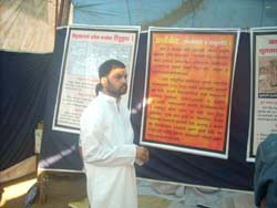 H.H. Lokeshanand Maharaj watching the exhibition
